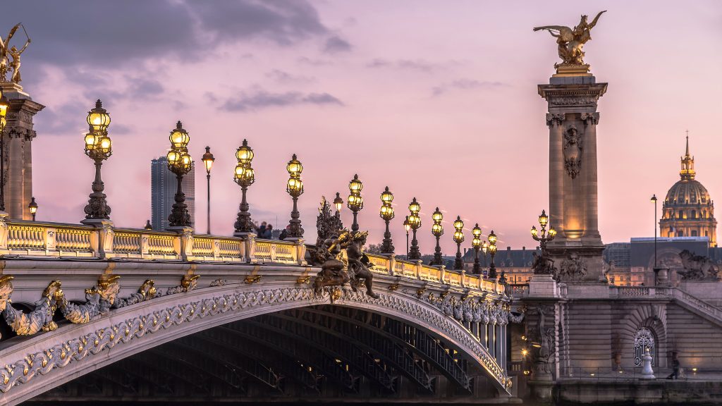 Pont Alexandre III bridge over Seine River at winter evening twilight, Paris, France