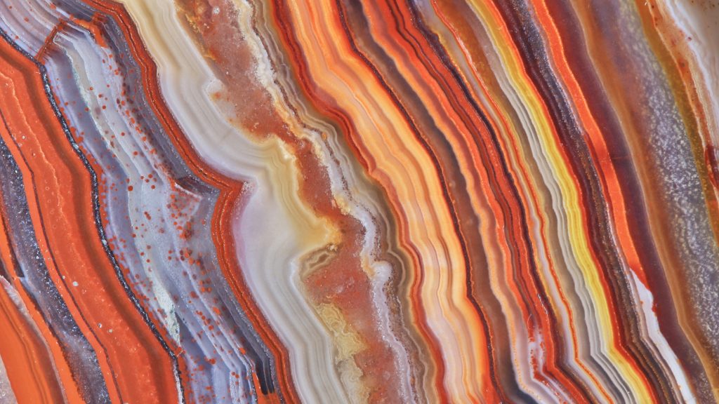Natural stone banding pattern in agate, close-up in full frame