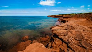 Read more about the article Rock cliff and clear water at Cavendish, Prince Edward Island, Canada