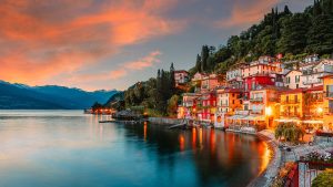 Read more about the article Varenna Village on Lake Como at summer sunset with illuminated houses, Lombardy, Italy