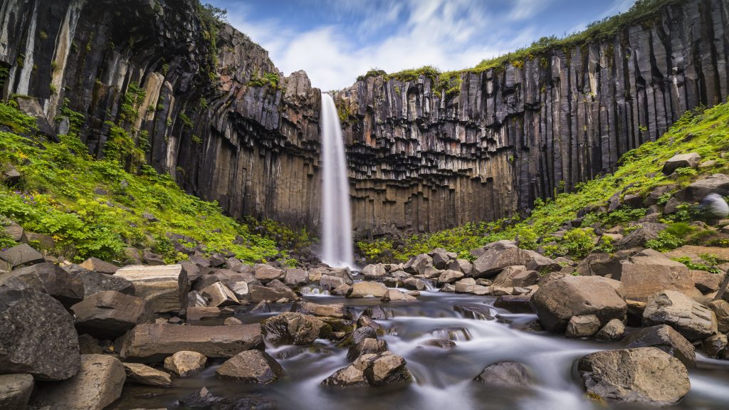 Svartifoss waterfall and rocks in summer, Skaftafell in Vatnajökull National Park, Iceland