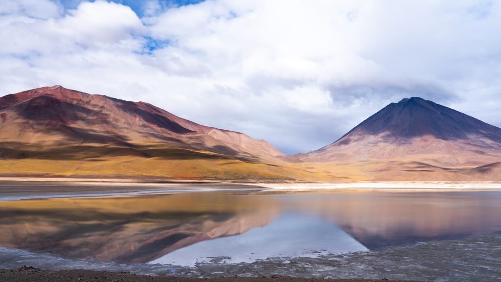 'Painted mountain' and Volcan Licanabur at Laguna Verde, Bolivian Highlands, Bolivia