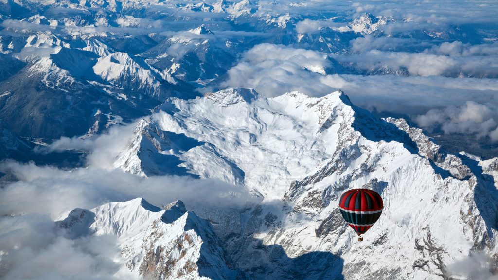 Hot air balloon over the Zugspitze in Wetterstein Mountains, Upper Bavaria, Germany
