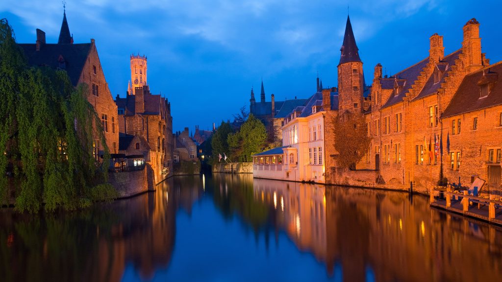 Canal in front of RozenhoedKaai in the old city of Brugge at dusk, Belgium