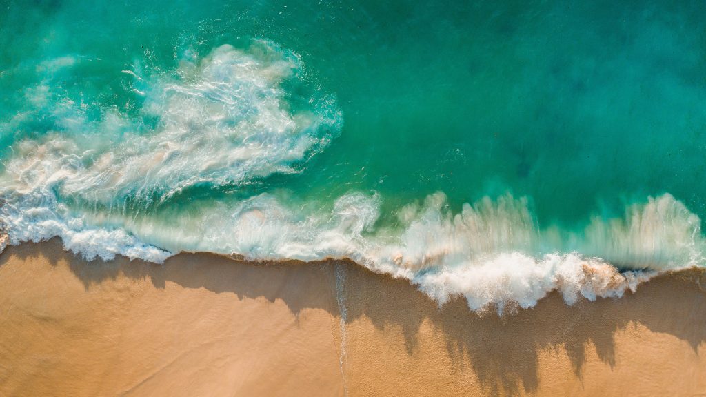 Aerial shot of waves on Kelingking Beach, Nusa Penida Island, Indonesia