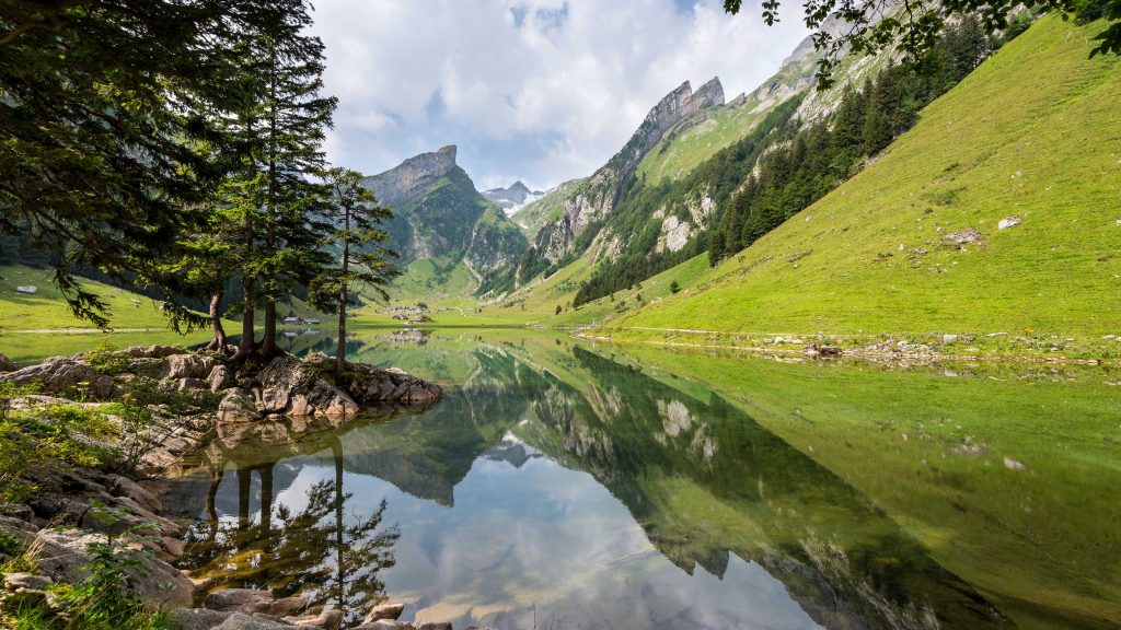 Clouds over mountains with reflection in lake, Appenzell Innerrhoden, Switzerland