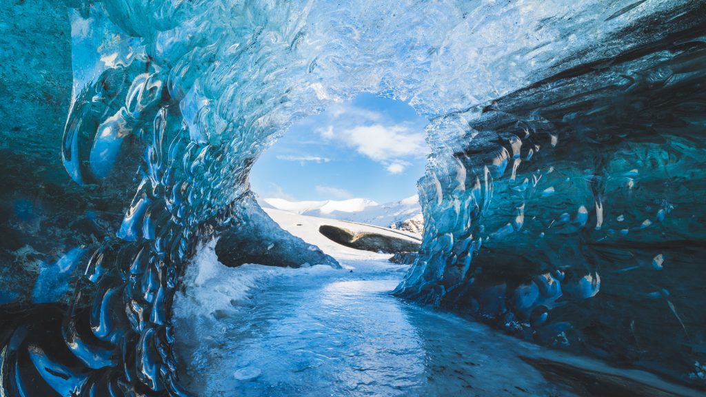 Ice cave at sunrise in Breiðamerkurjökull glacier in winter, Iceland