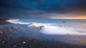 Read more about the article Waves washing up on sandy beach, Kaikōura, South Island New Zealand