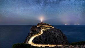 Read more about the article Milky Way stars and road at Far de Formentor lighthouse on Mallorca, Spain