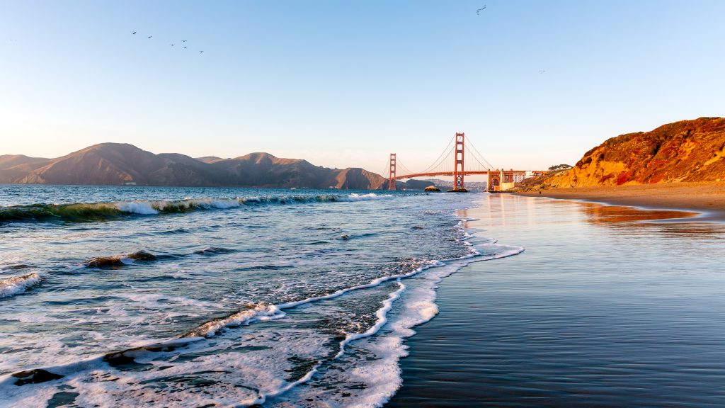 Baker Beach and Golden Gate Bridge on a sunny day, San Francisco, California, USA