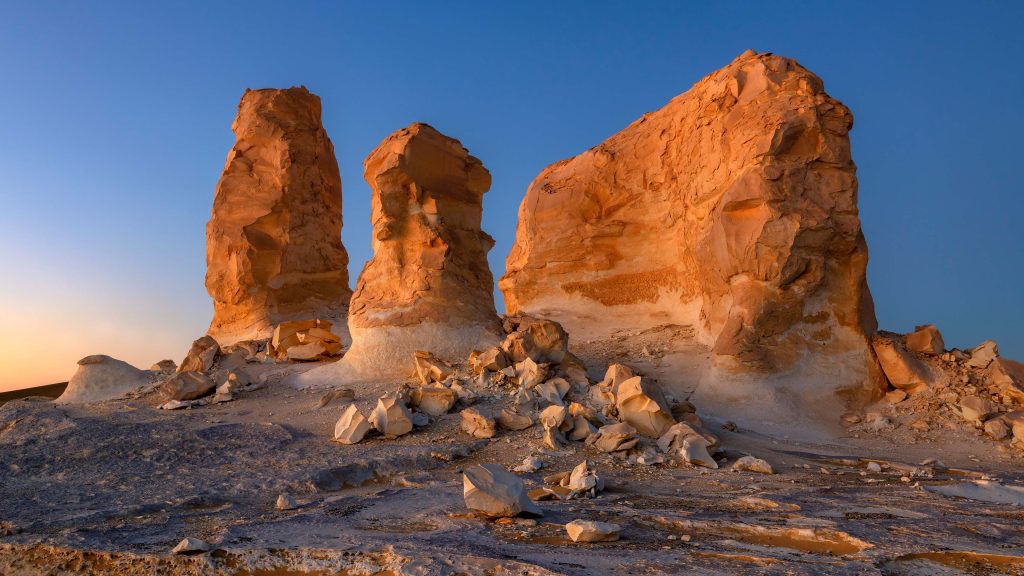 Rock towers at dusk in El Agabat area in White Desert National Park, Egypt