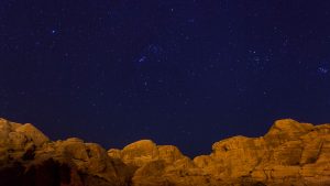 Read more about the article Night sky over the mountains next to the Petra, Maan, Jordan