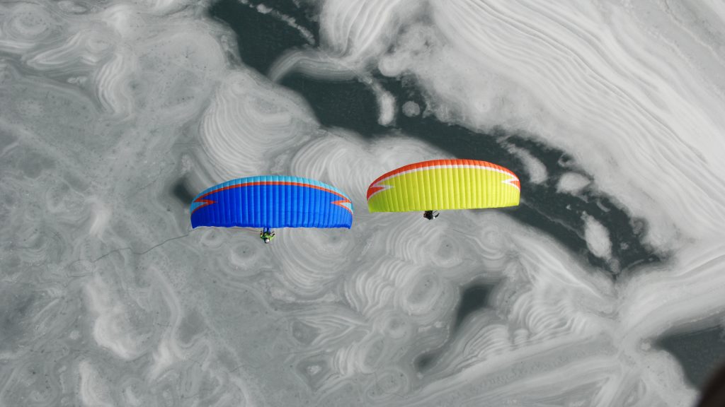 Paragliders over the frozen Achensee lake in Tyrol, Austria