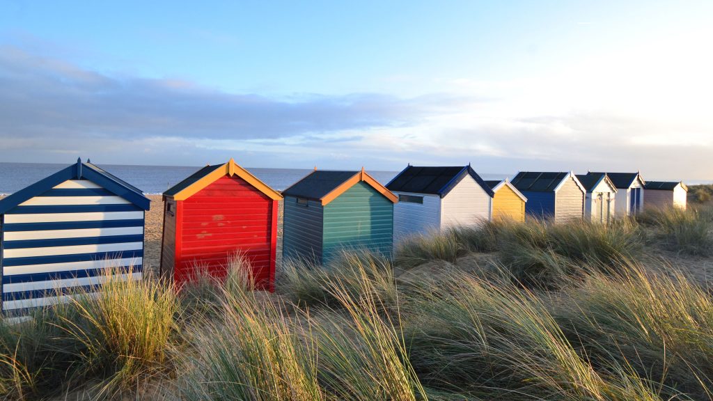 Painted beach huts in Southwold, Suffolk, England, UK