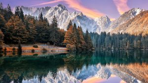 Read more about the article Lower Lake Fusine in front of the Mongart mountain under sunlight, Italy