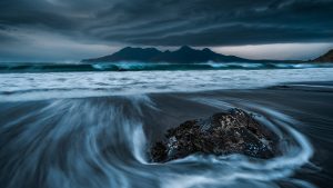 Read more about the article Lenticular clouds over Isle of Rùm seen from Eigg at dusk, Scotland, UK