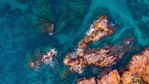 Read more about the article Aerial view over rocks landscape and sea at Costa Brava, Catalonia, Spain