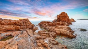 Read more about the article Red rocks at Cea Beach, Tortoli, Ogliastra, Sardinia, Italy