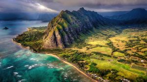 Read more about the article Scenic view of sea and mountains against sky, Ka’a’awa, Oʻahu, Hawaii, USA