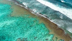 Read more about the article Drone image showing an exposed reef at low tide, Uluwatu, Bali, Indonesia