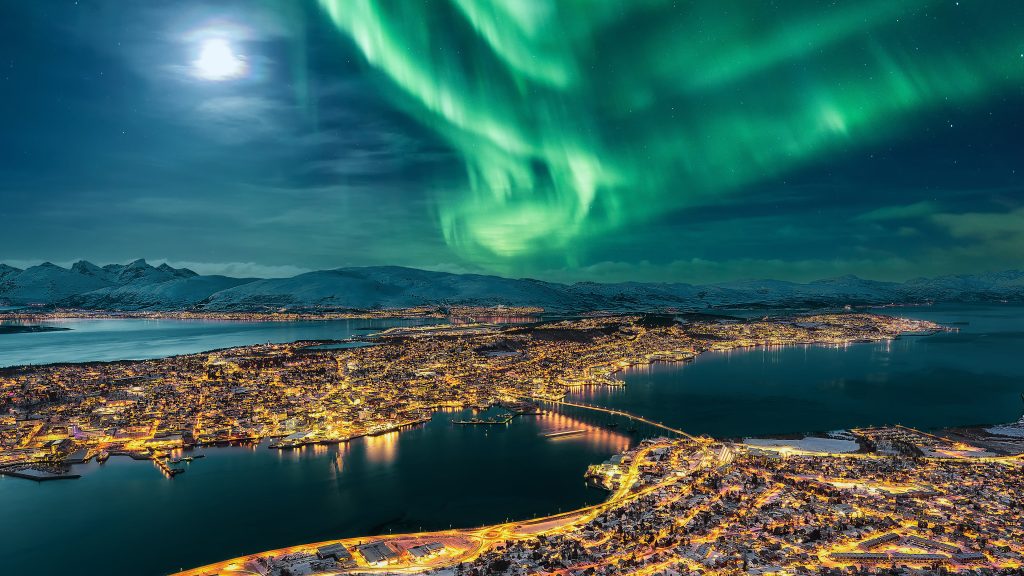 Aurora Borealis dancing over Tromsø and full moon, Northern Norway